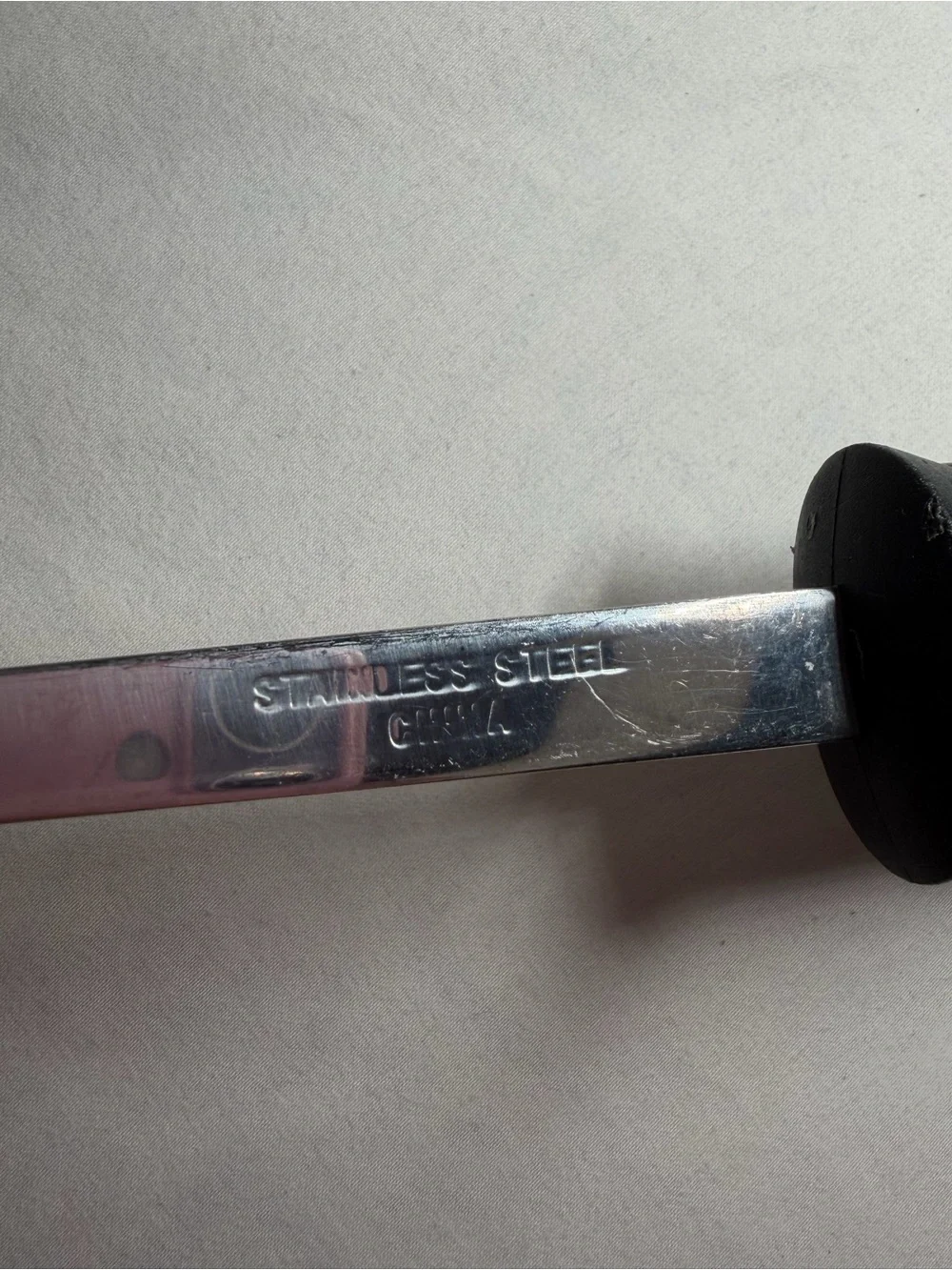 Stainless Steel Turner Spatula with White Handle and Black Grip - EKCO